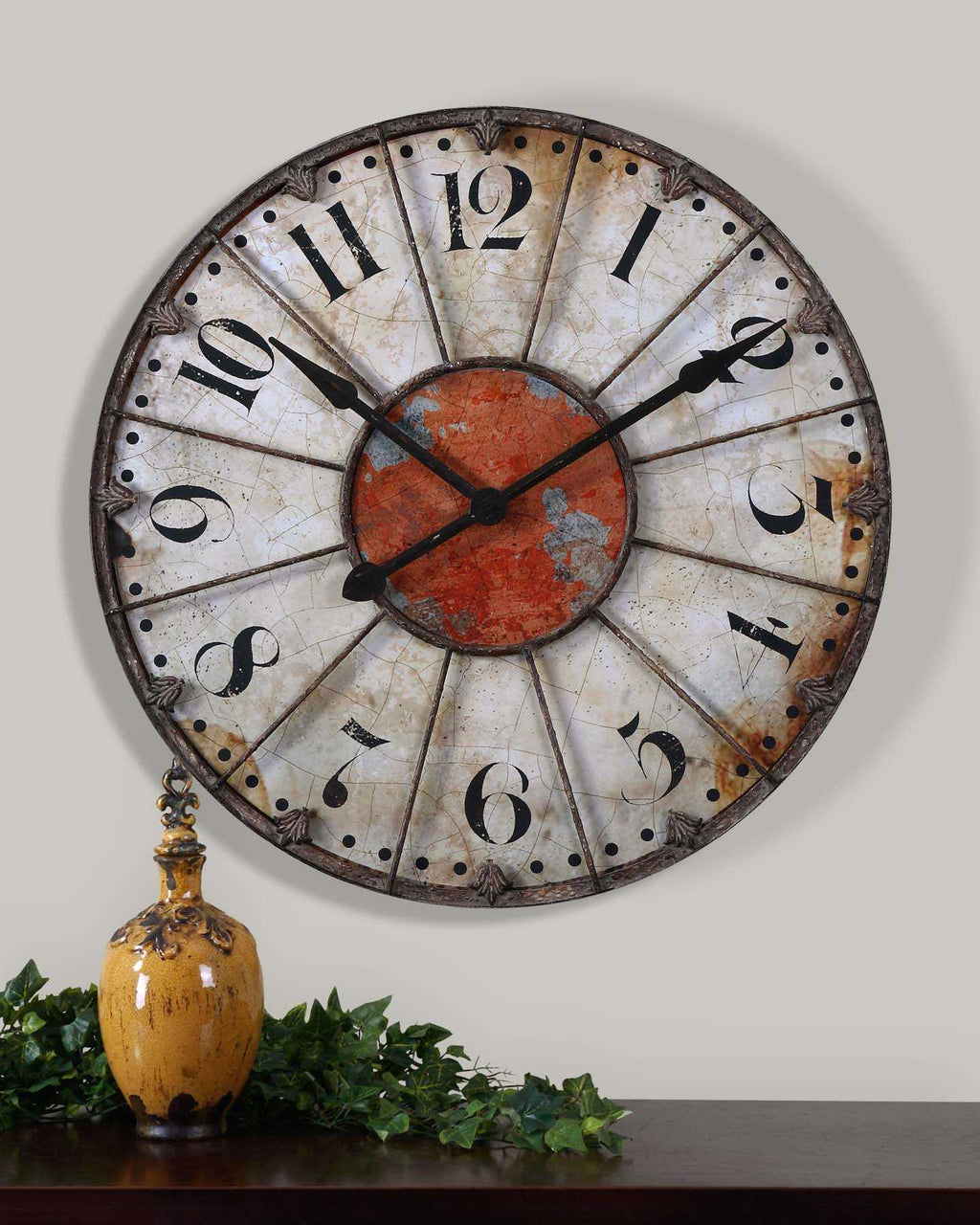 Ellsworth Wall Clock  Wall clock featuring a crackled ivory face with rust red accent and rustic bronze metal details. Quartz movement ensures accurate timekeeping. Requires one "AA" battery.  Dimensions:29 W X 29 H X 2 D (in)