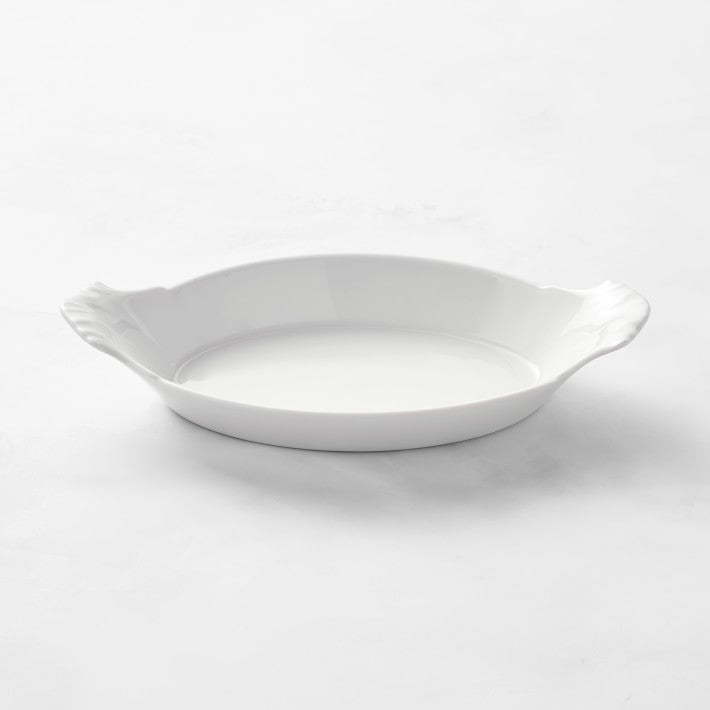 Apilco Porcelain Oval Au Gratin, No 9 Dish  A classic! White porcelain au gratin dish for oven-to-table two or hearty one size serving!  Use for fruit crisps, potatoes gratin, seafood casseroles.  No. 9: 12.85-oz. cap.; 10" x 5 1/2" x 1 1/3" high. Oven Safe, dishwasher safe, microwave safe.  Made in France by Apilco.  Perfect condition.