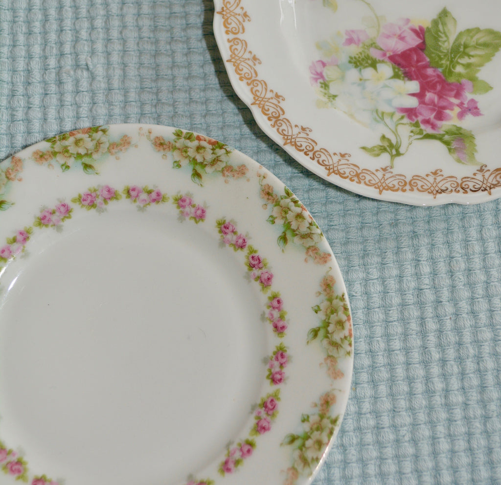 Antique Floral Dessert Plate Pair   6.25"   Porcelain Dessert in a lovely floral pattern. Manufactured by Hermann Ohme, Silesia, Germany (now Szczawienko, Poland) from 1882 to 1930.  This pretty pair of dessert plates will look lovely as part of a vintage table setting.  Guilded Edge.  French Vintage 