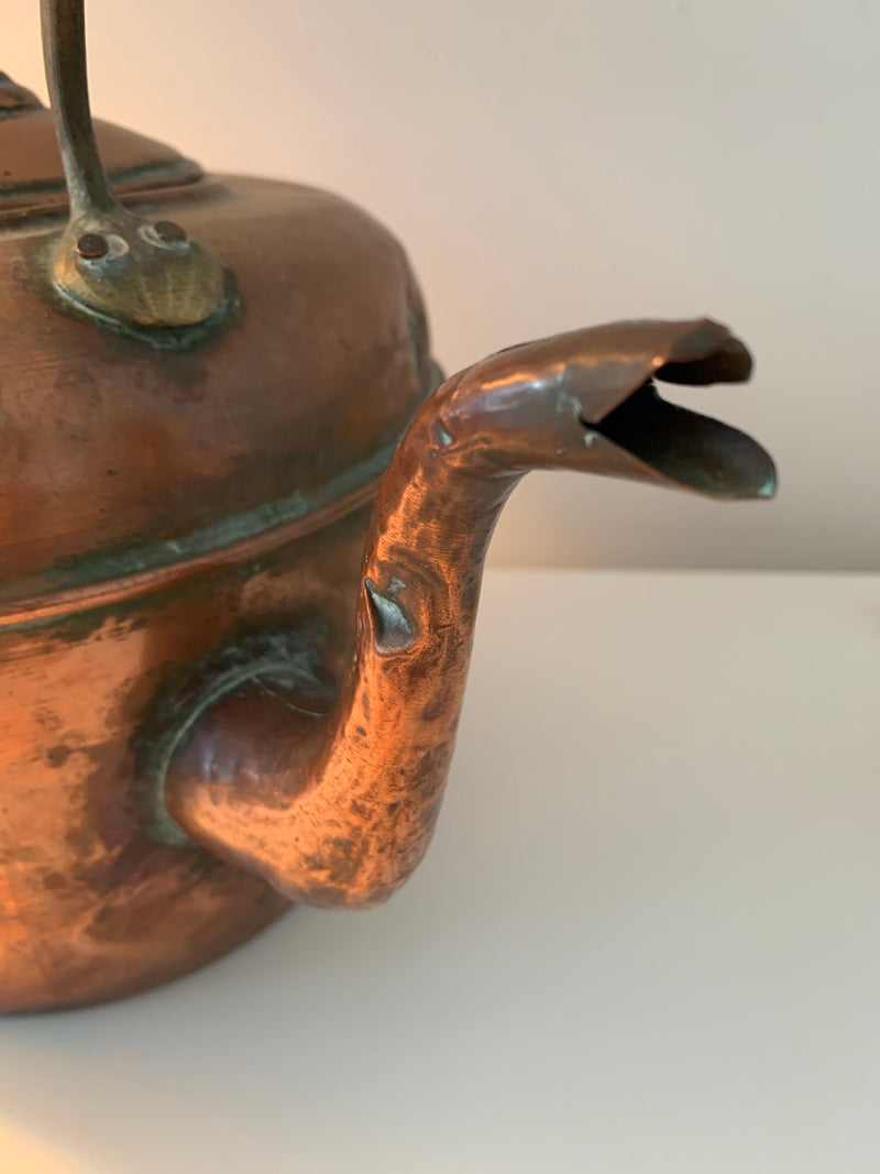 Antique French Large Copper Tea Pot  This large copper tea pot has the patina of a well loved household item. A little love and it could restored to its glory OR use as is for flowers or a humidifier near a fireplace or wood stove. 13" tall x approx. 13" wide.
